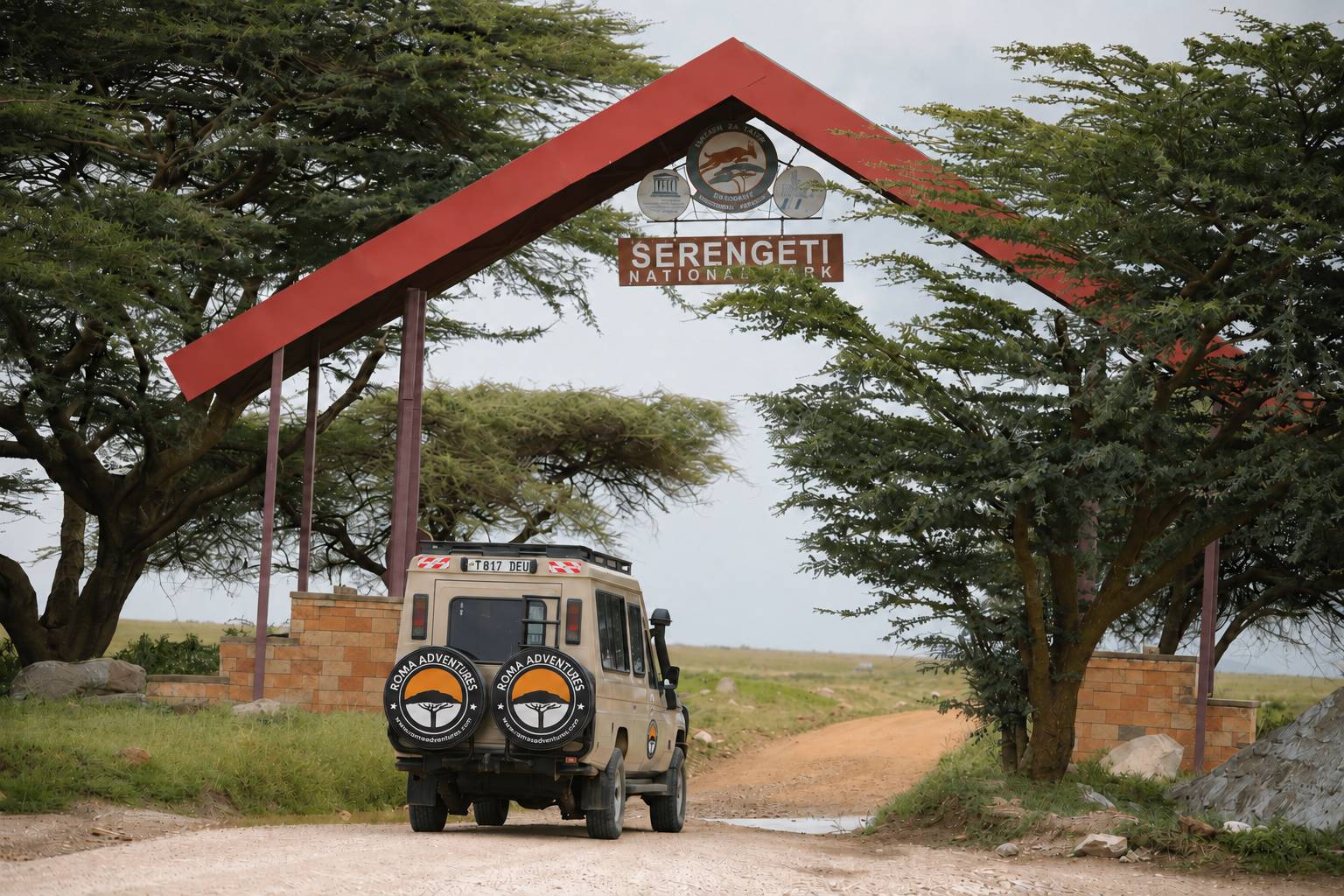 Roma Adventures safari vehicle at Serengeti National Park gate
